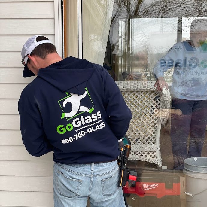 A GoGlass employee installs a patio door for Delmarva homeowner