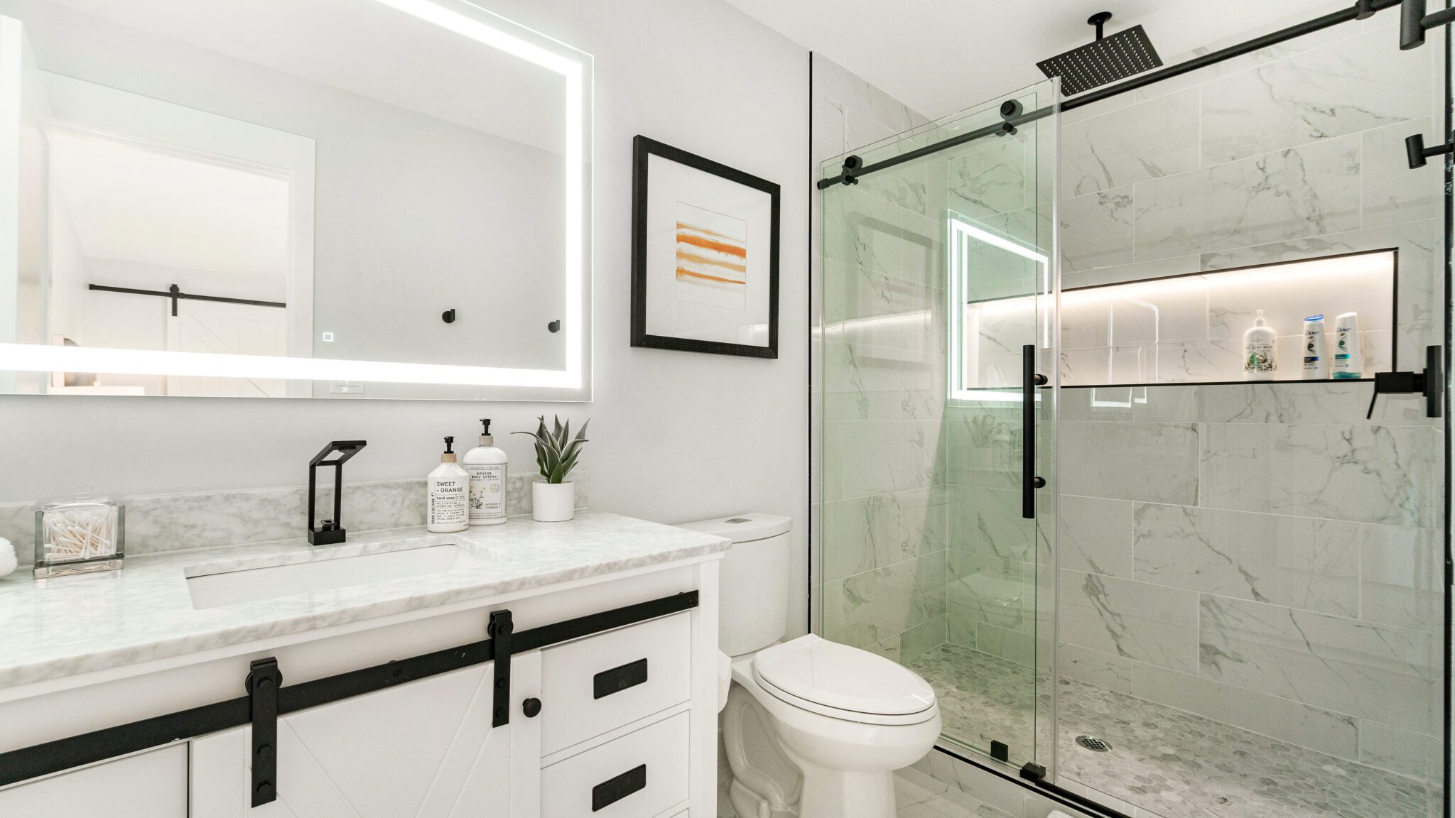 White bathroom with sliding glass shower door