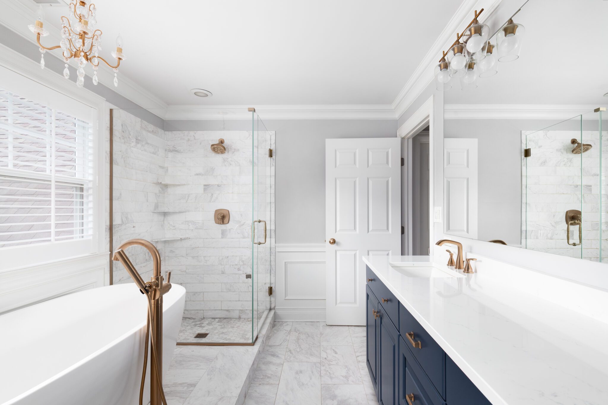 Corner shower in white and gold in new modern bathroom