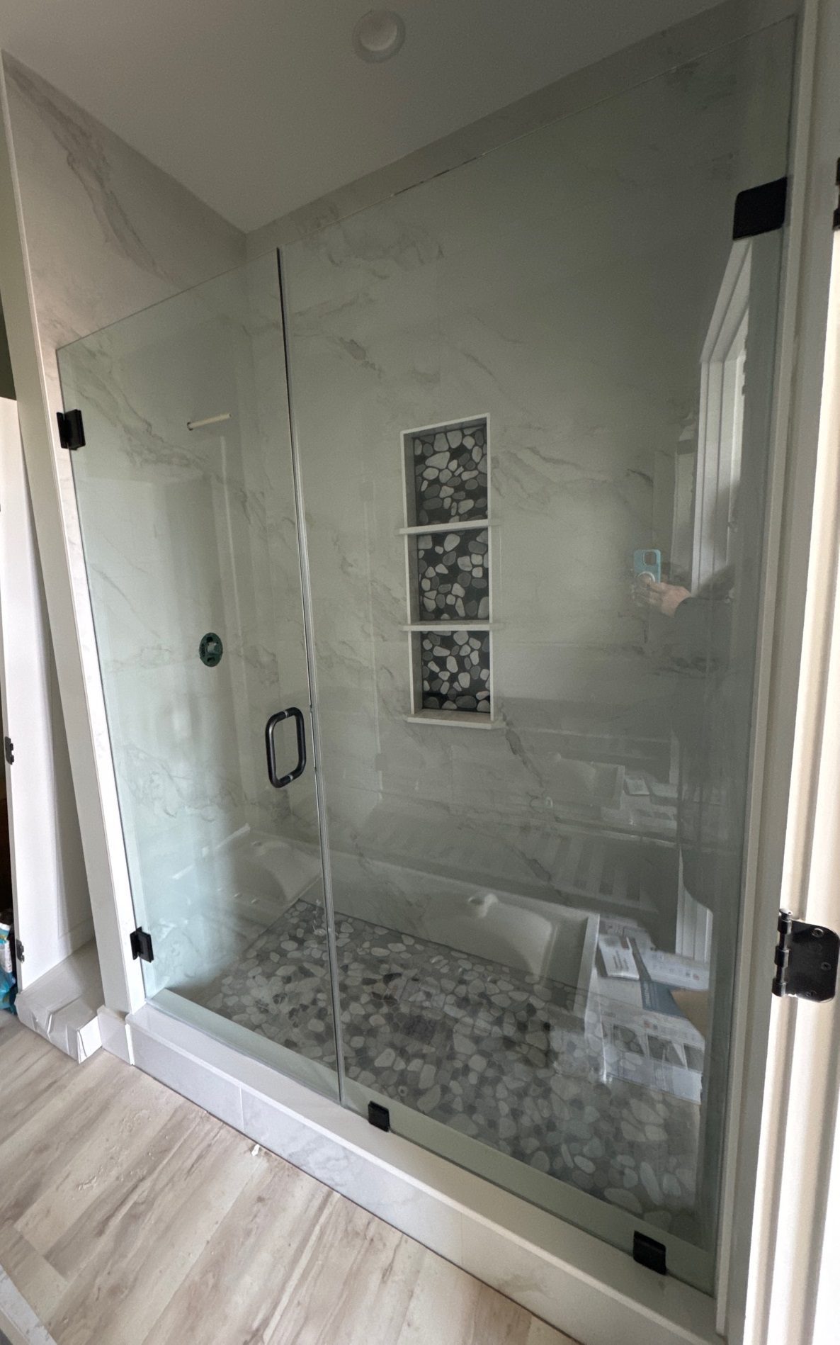 New shower glass with stone look bottom and marble look surround