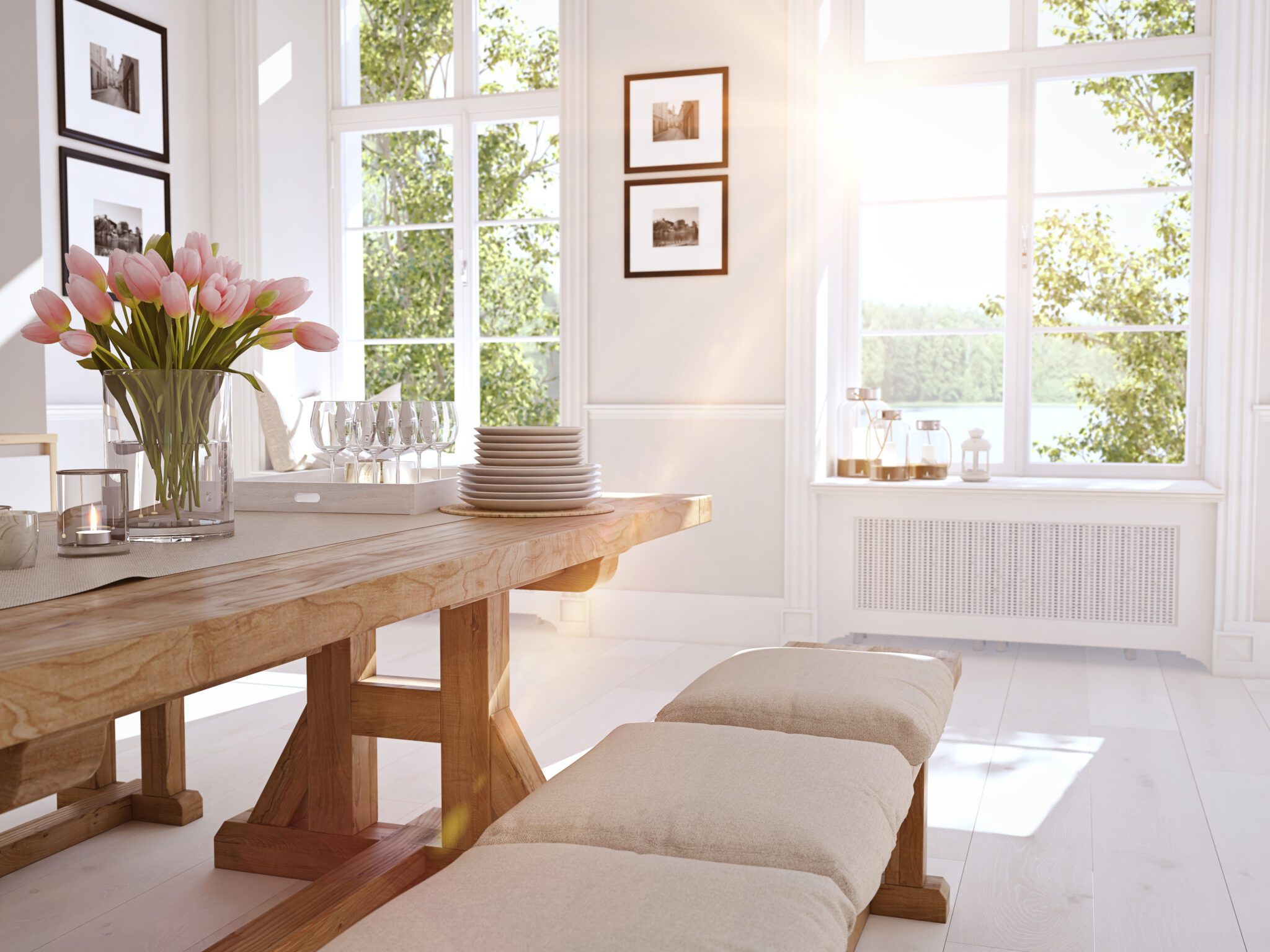 Windows in white dining room with wood table