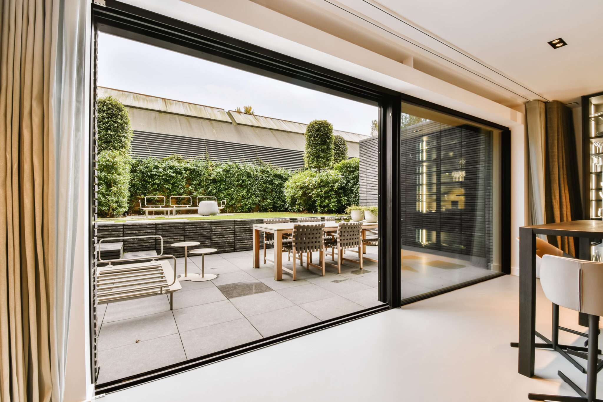 Large sliding glass door with black frame