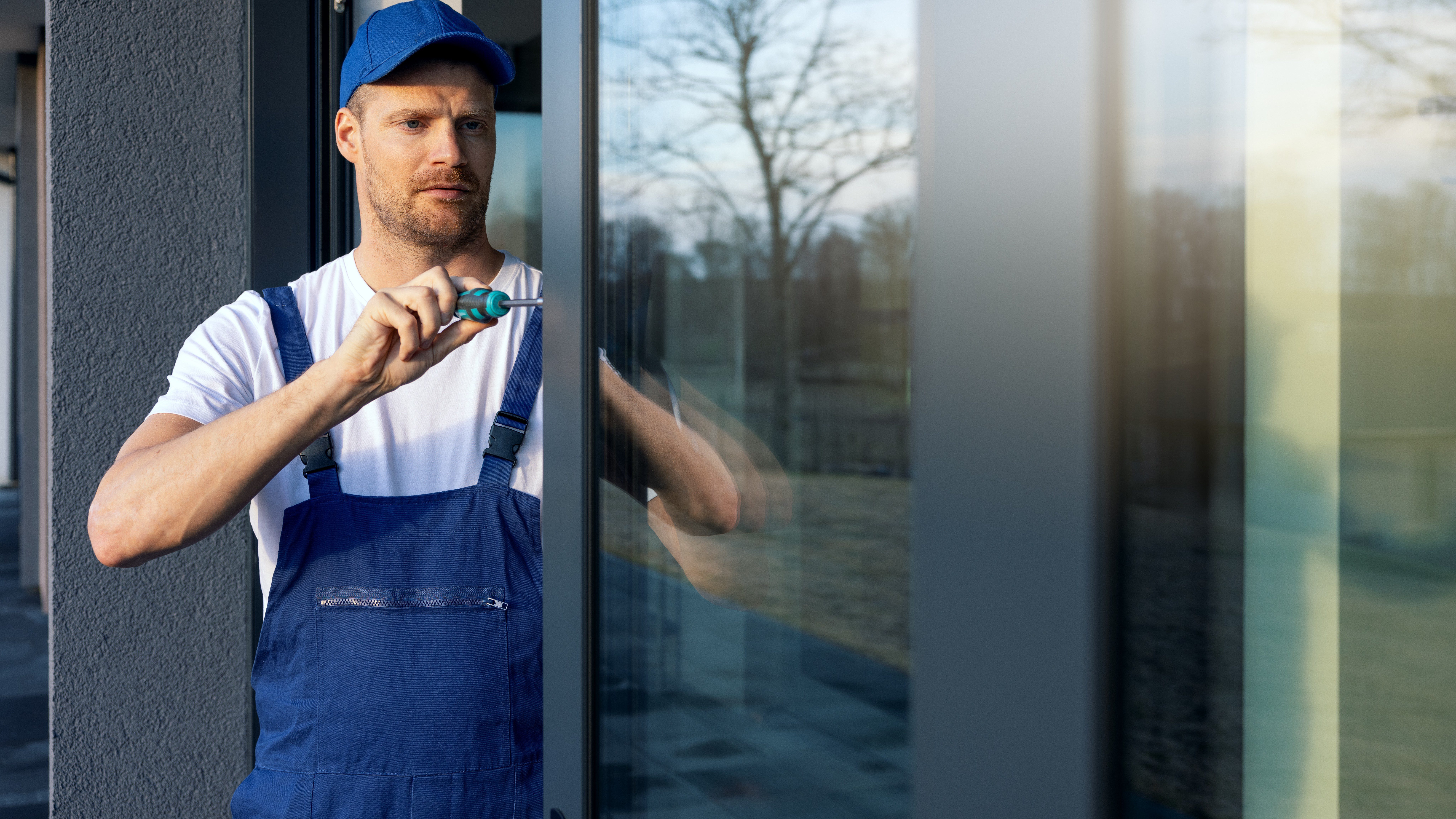 Close view of a technician installing a sliding glass patio door