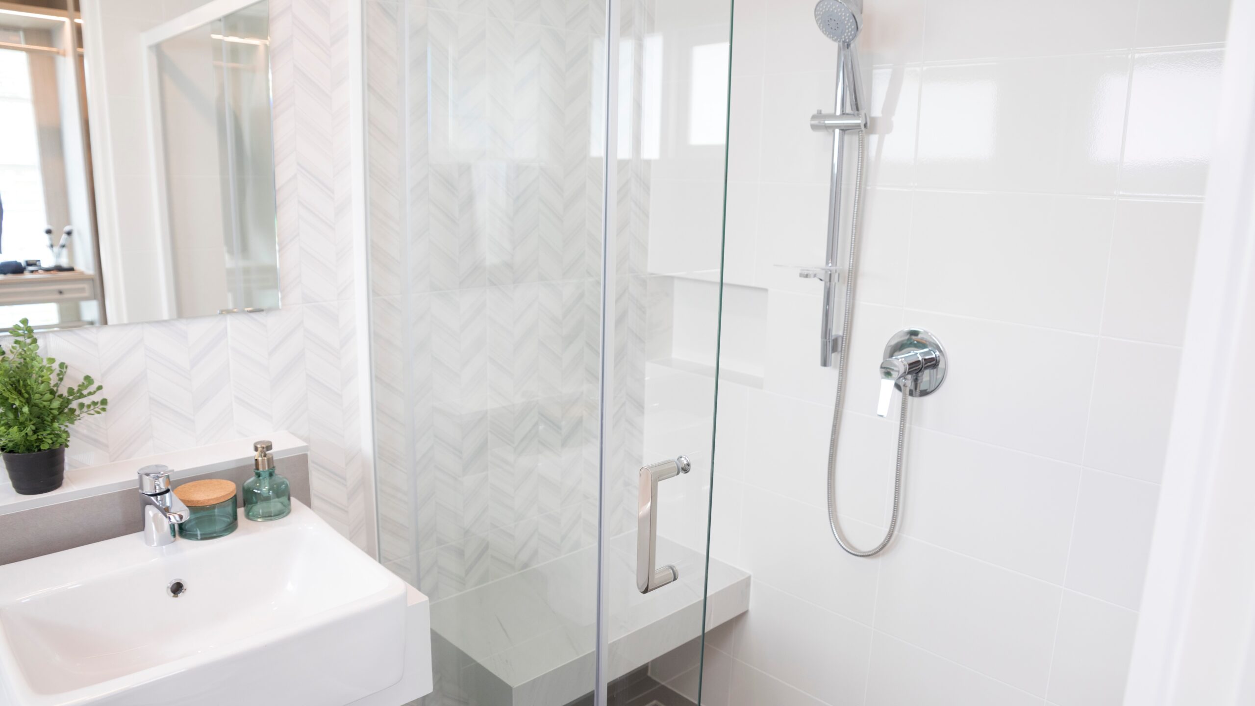 Close view of a beautiful bathroom with a small glass shower enclosure